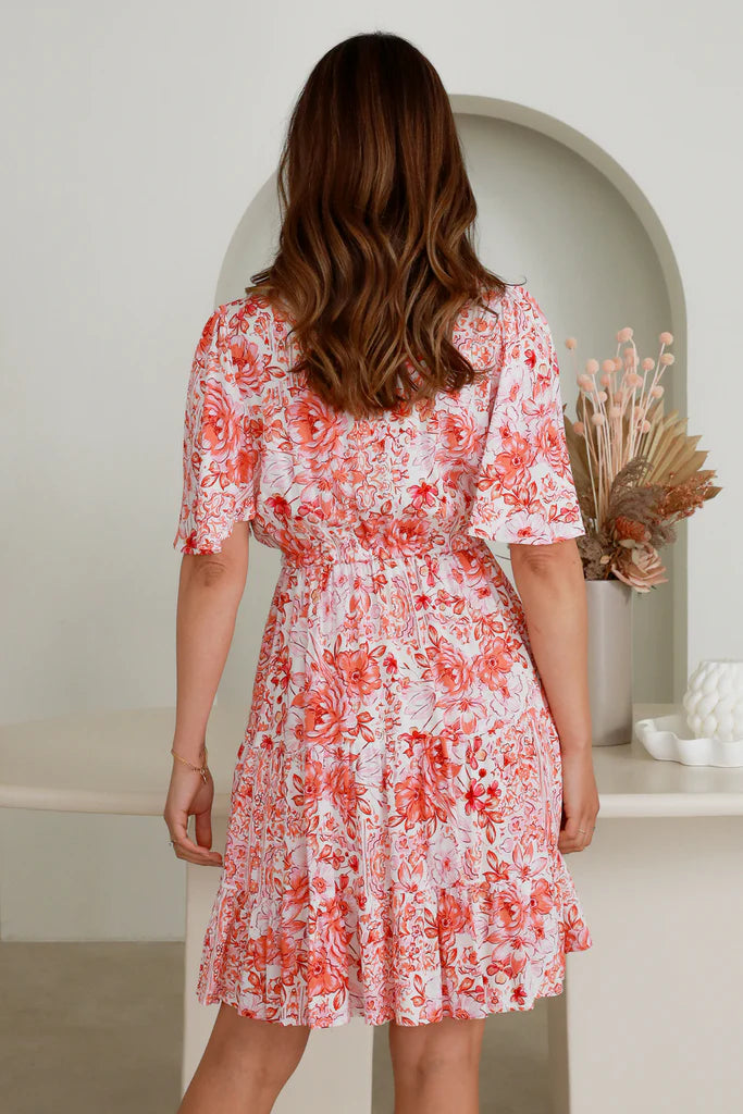 Introducing the Ida Mini Dress - the perfect combination of sophistication and playfulness. With a drawstring waist, cinched in to accentuate the figure, and delicate button detail, it will become an instant staple in any wardrobe. An eye-catching tiered style paired with structured bell sleeves creates a timeless yet contemporary look. Treat yourself to luxury.