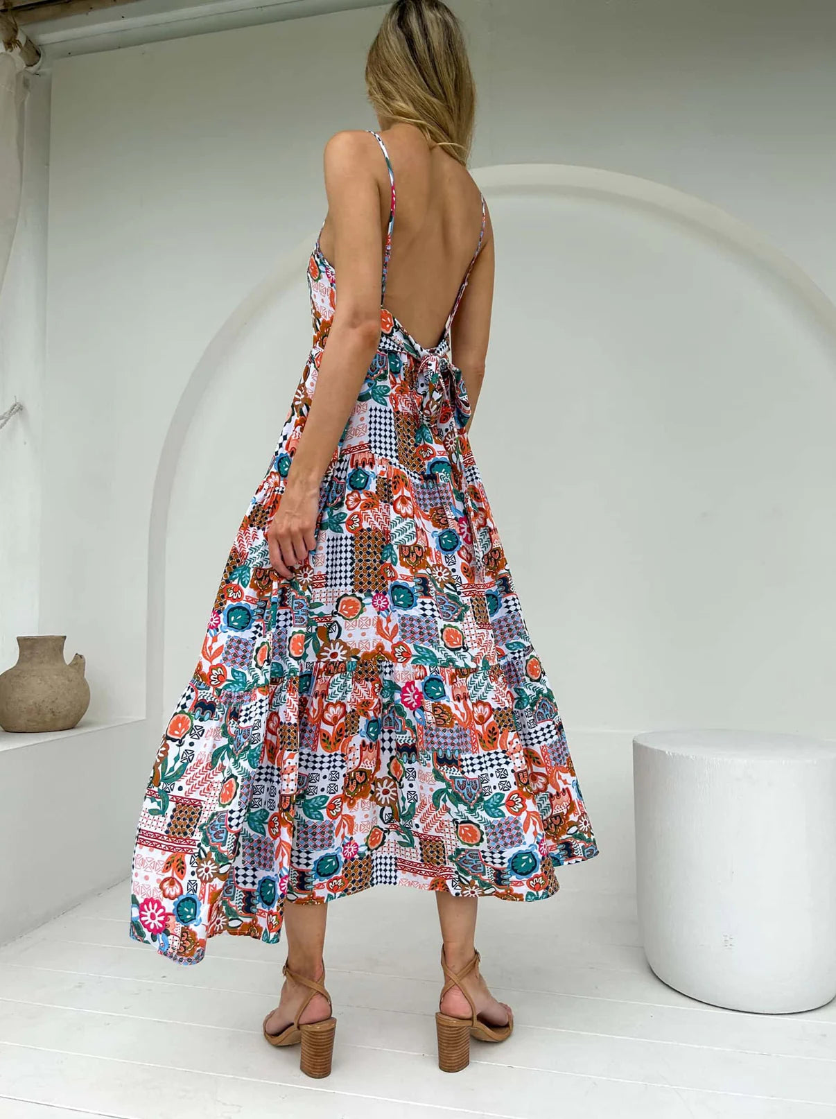 Crafted from luxurious silk fabric, the Georgie Maxi dress oozes elegance and sophistication. With its tie-around detail and low back, this timeless piece is sure to make an impression. Complete with spaghetti straps for a secure fit, you'll be ready to grace any special occasion.