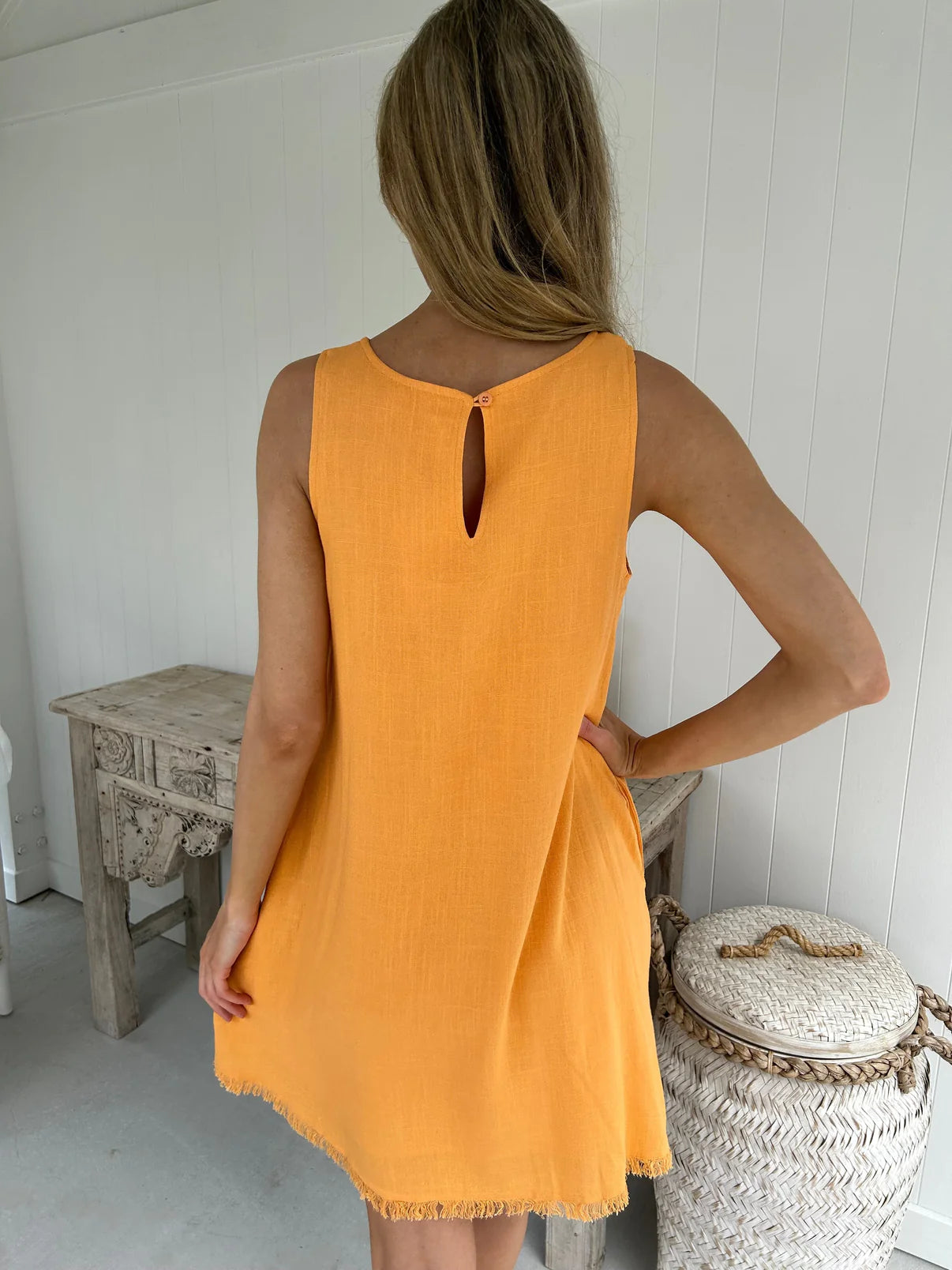 Be inspired by the beauty of nature with this Freya Mini Dress. Featuring a gorgeous earthy orange, a frayed hem, and pockets, this shift fit dress is both stylish and practical. Its lightweight fabric is fully lined to keep you feeling comfortable and looking chic all day long. Perfect for any occasion.