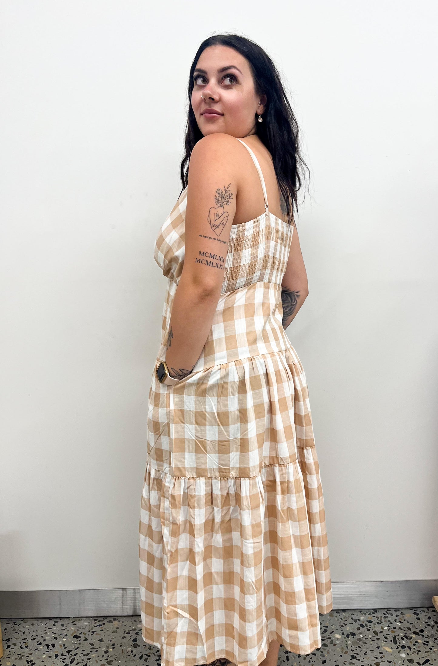 The Oddie Midi Dress offers timeless elegance with a modern twist. This midi-length dress features a sophisticated V-neckline and tiered style that will make you look and feel extremely stylish and luxurious. Crafted with the highest quality materials for a luxurious and comfortable fit, this is the perfect dress for any special occasion.