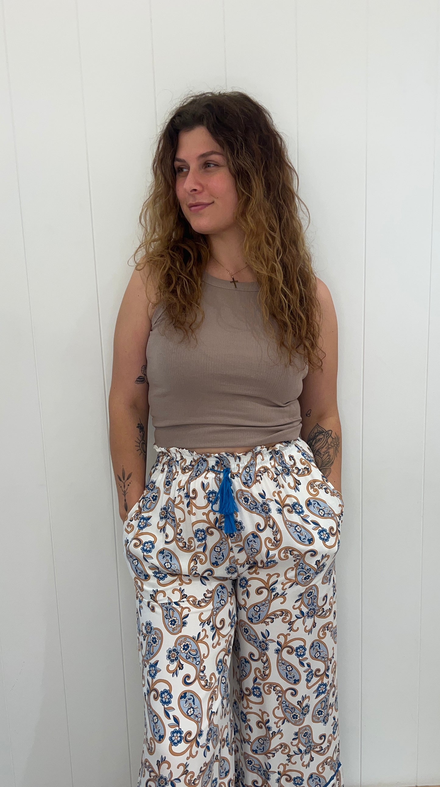 Our Callie Pants feature an elasticated waist, drawstring, tassel detail and pockets, making them a luxurious and stylish choice for any wardrobe. Crafted with exquisite attention to detail, these trousers will add a touch of sophistication to any outfit.