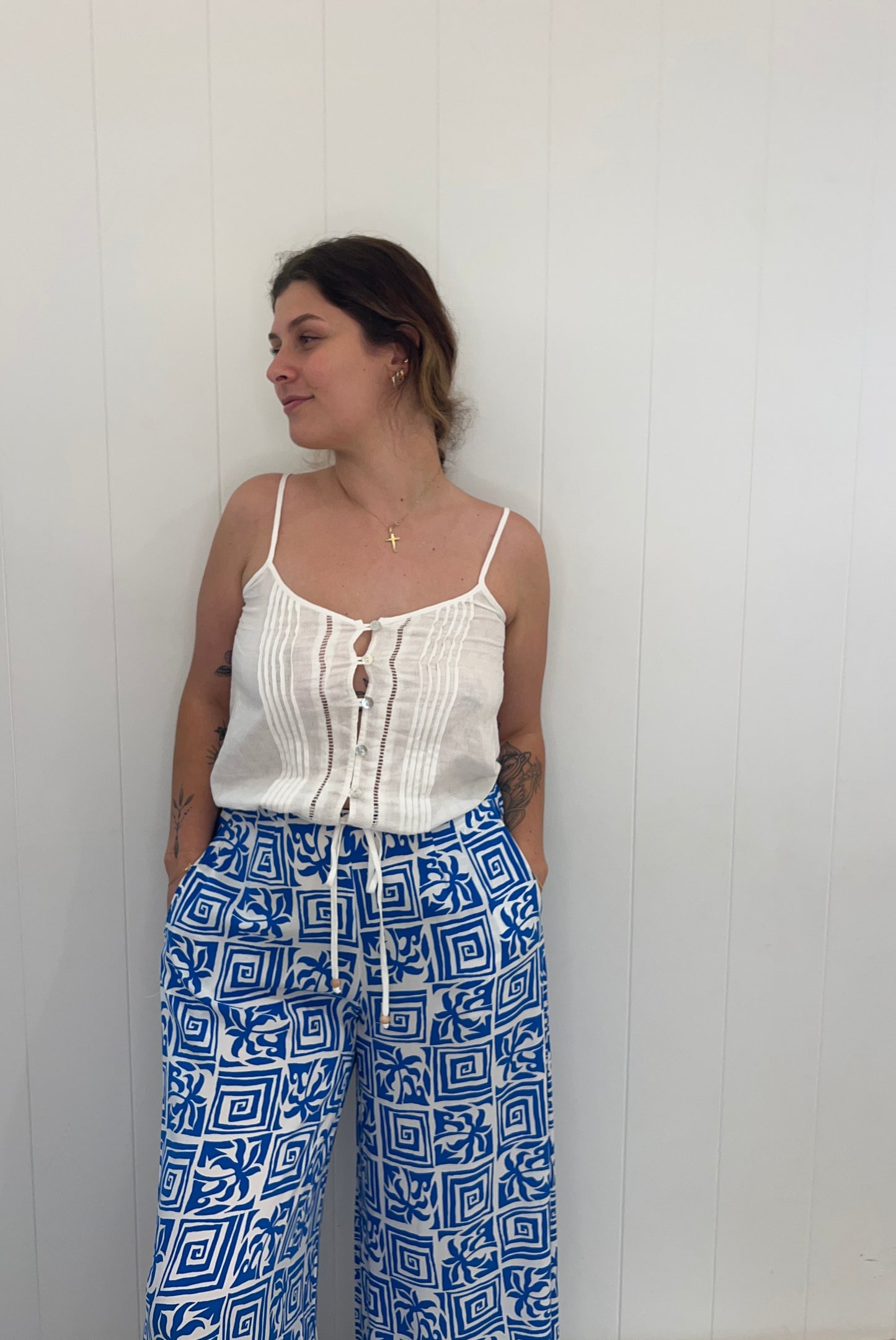Our Santorini Pants accentuate your figure with effortless grace. With an elasticated waist and timeless pockets, these versatile pants are the perfect addition to your wardrobe for any occasion, providing comfort and elegance.