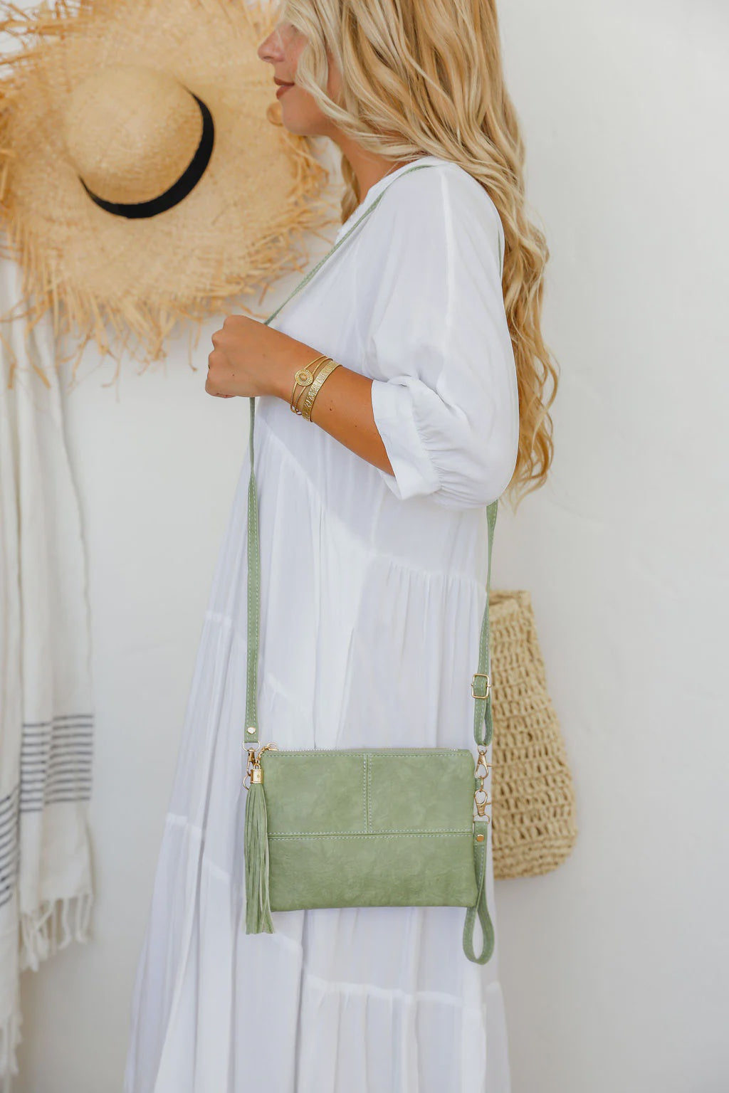 Get ready for some serious style with our Pistachio Clutch! With a long strap and wrist strap included, it's perfect for a night out. Keep your essentials organized with the lined inside and add some fun with the matching tassel. Don't just carry a bag, make a statement!