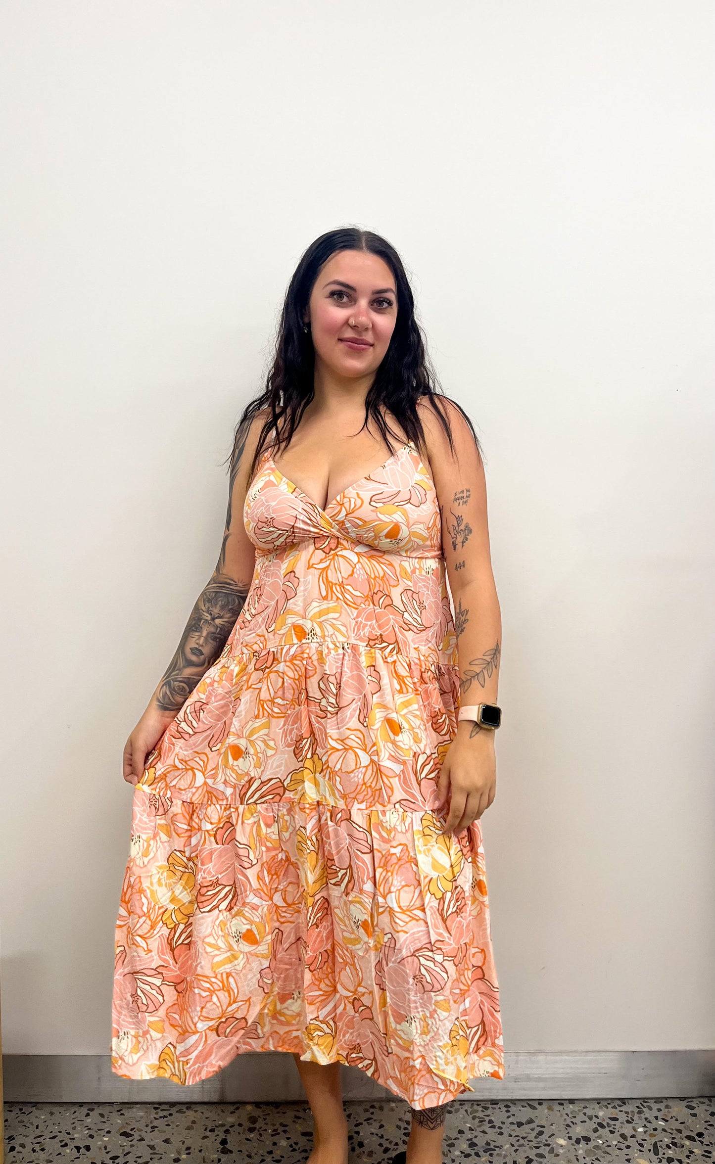 Introducing the Flower Power Midi Dress - the perfect combination of timeless elegance and modern sophistication. Featuring a V neckline, spaghetti straps, and a tiered style, this dress will add a touch of luxury to any ensemble.