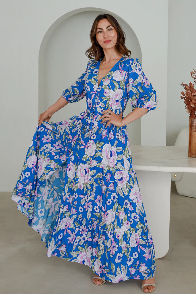 Step out in style this season with the Hattie Maxi Dress. Layer this elegant dress over any look and enjoy the comfort and versatility of its features. With a drawstring waist, V-neckline, and button details, you'll enjoy the slimming silhouette, while split at the leg and elasticated long-sleeved cuff allows for an effortless transition from day to night.