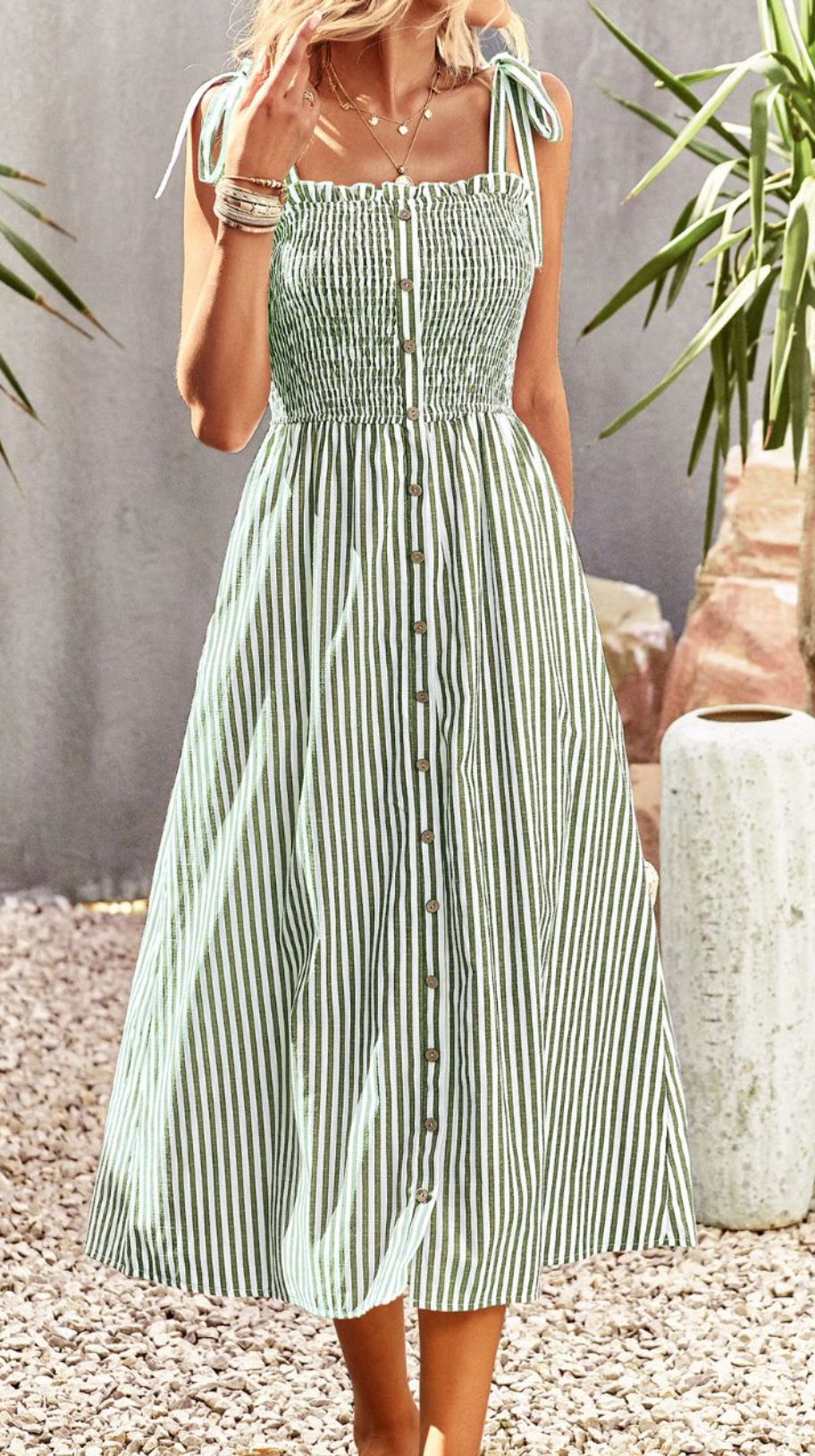 This Melody Midi dress is the epitome of timeless sophistication. With its intricate button details, contemporary tie-up accents, and elegant midi length, this dress is perfect for an evening of luxury and style. With its high quality craftsmanship and exclusive design, this dress will have you effortlessly making an unforgettable statement.
