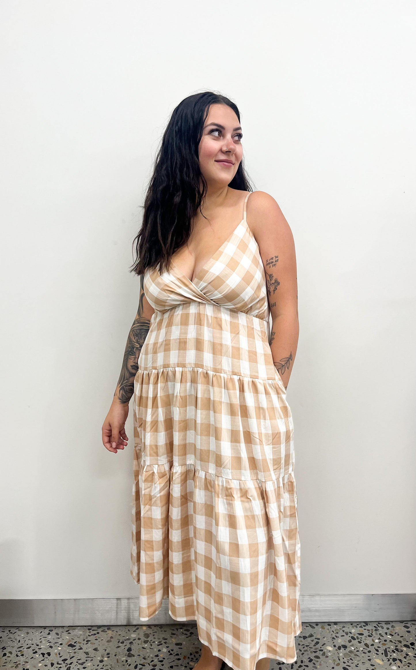 The Oddie Midi Dress offers timeless elegance with a modern twist. This midi-length dress features a sophisticated V-neckline and tiered style that will make you look and feel extremely stylish and luxurious. Crafted with the highest quality materials for a luxurious and comfortable fit, this is the perfect dress for any special occasion.
