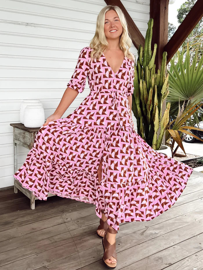The Tessa Dress has it all - 3/4 length sleeves creating a timeless silhouette, a V-neckline with buttons through the bust for a hint of sophistication, a drawstring waist for definition and a floor-length maxi for luxurious elegance. A sophisticated and exclusive statement piece that will turn heads.