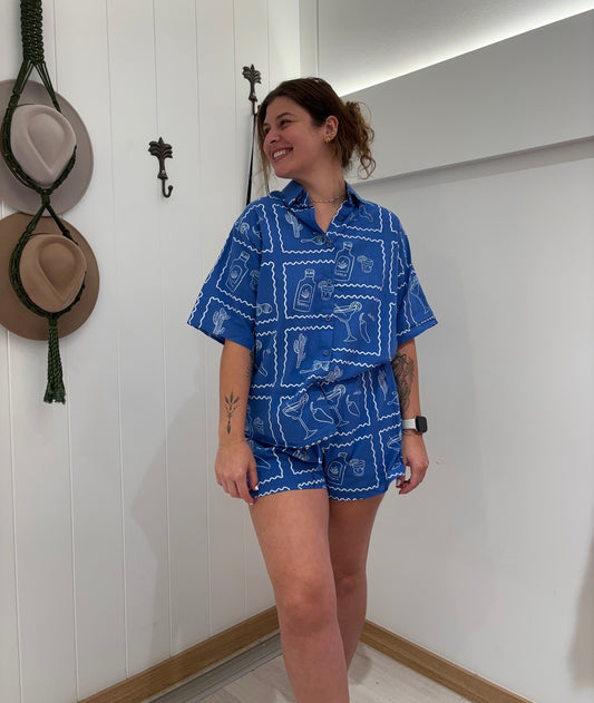 Get ready for a fiesta with our Blue/White Cactus Tequila Set! These elasticated shorts with a tie-up and lining offer comfort, while the collar and button details add a touch of style. Perfect for those warm summer days (and crazy nights). Siesta, anyone?