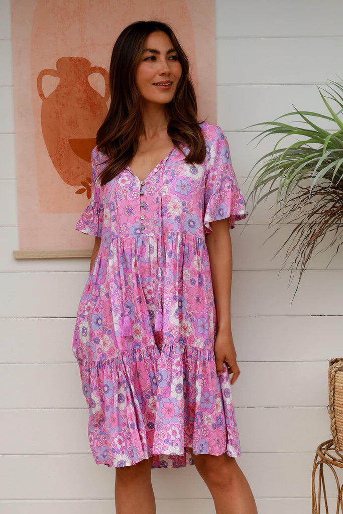 Discover timeless elegance with Eliana Mini Dress. A tiered, drawstring design with a v-neckline and button details creates an effortless look, perfect for any special occasion. Achieve a classic silhouette and enjoy the luxurious feel of this exclusive, sophisticated dress.