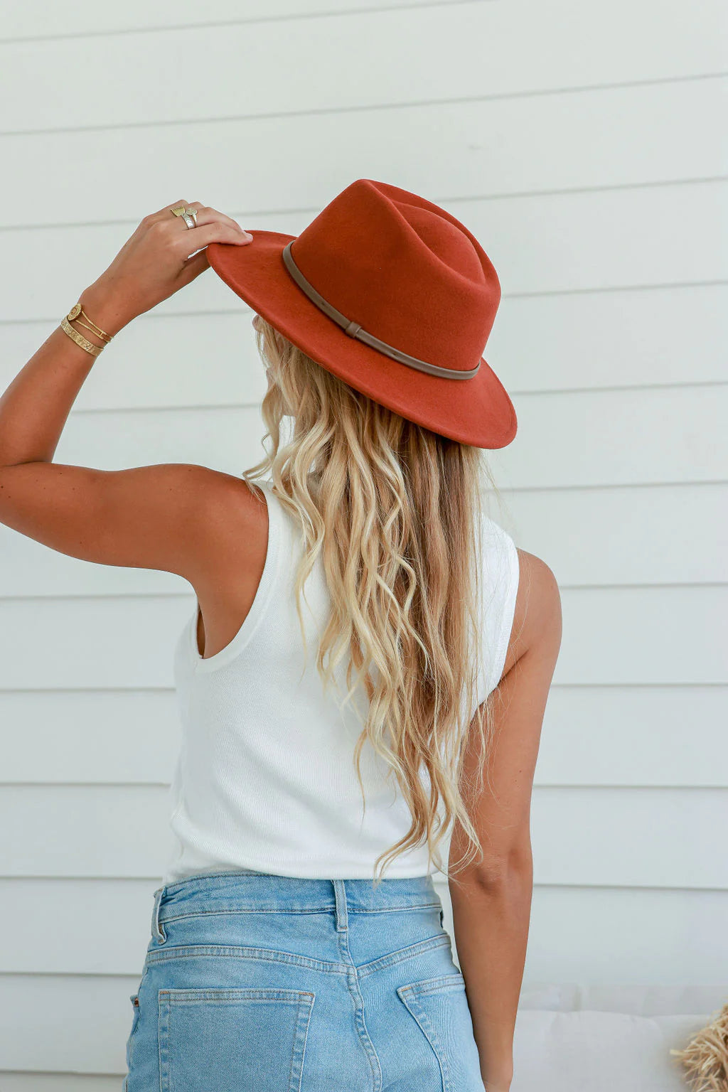 Discover timeless style with our Beverly Hat. Crafted in luxurious wool and featuring a distinctive fedora style, this hat is the perfect addition to any outfit. With a pinch teardrop shaped crown, wide brim, and leather band accessory, you're sure to look elegant and sophisticated with this classic piece.