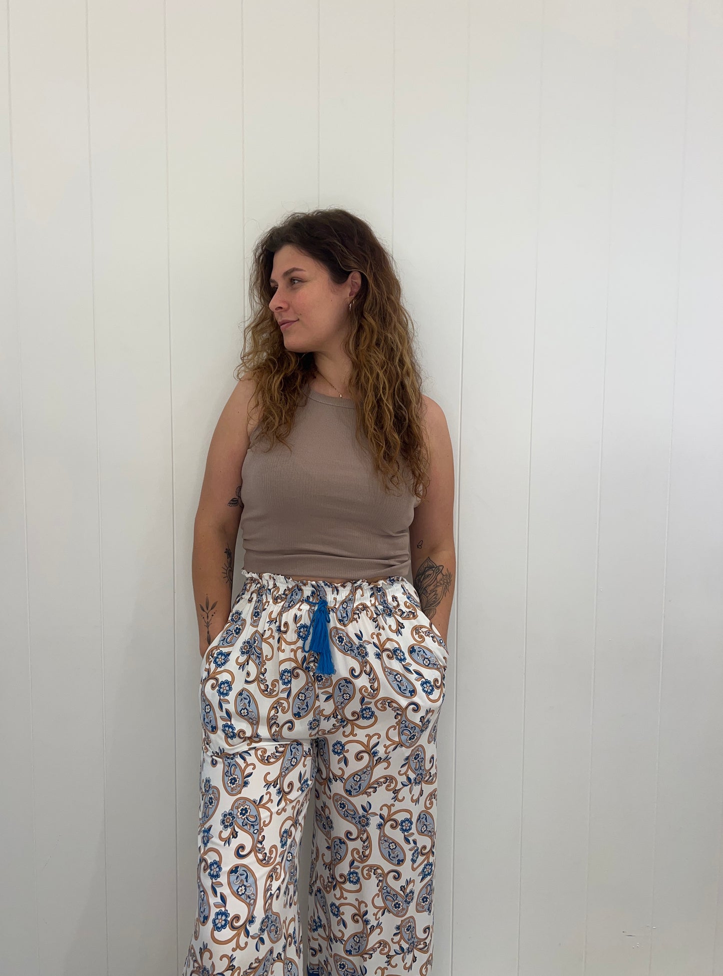 Our Callie Pants feature an elasticated waist, drawstring, tassel detail and pockets, making them a luxurious and stylish choice for any wardrobe. Crafted with exquisite attention to detail, these trousers will add a touch of sophistication to any outfit.