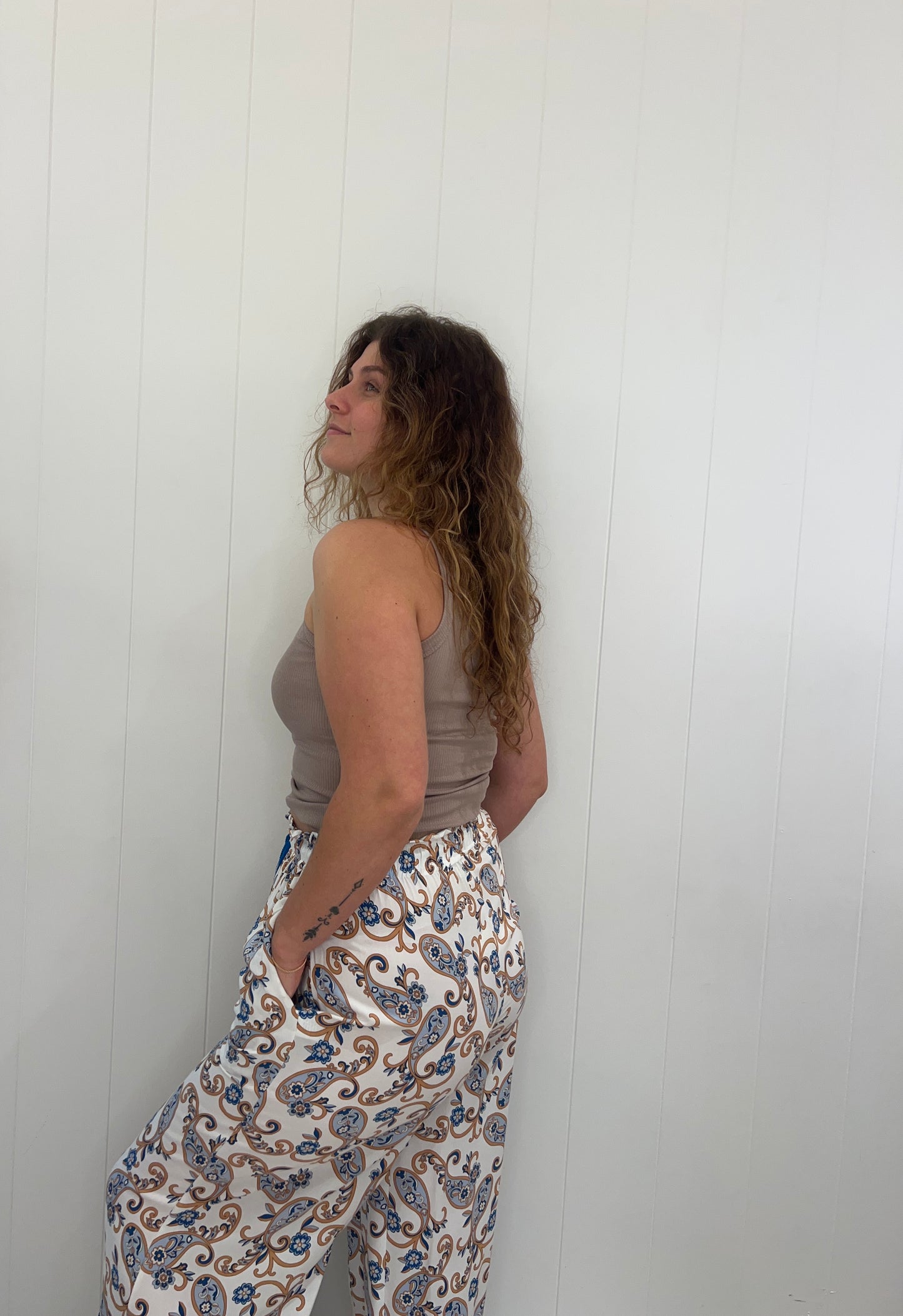 Our Callie Pants feature an elasticated waist, drawstring, tassel detail and pockets, making them a luxurious and stylish choice for any wardrobe. Crafted with exquisite attention to detail, these trousers will add a touch of sophistication to any outfit.