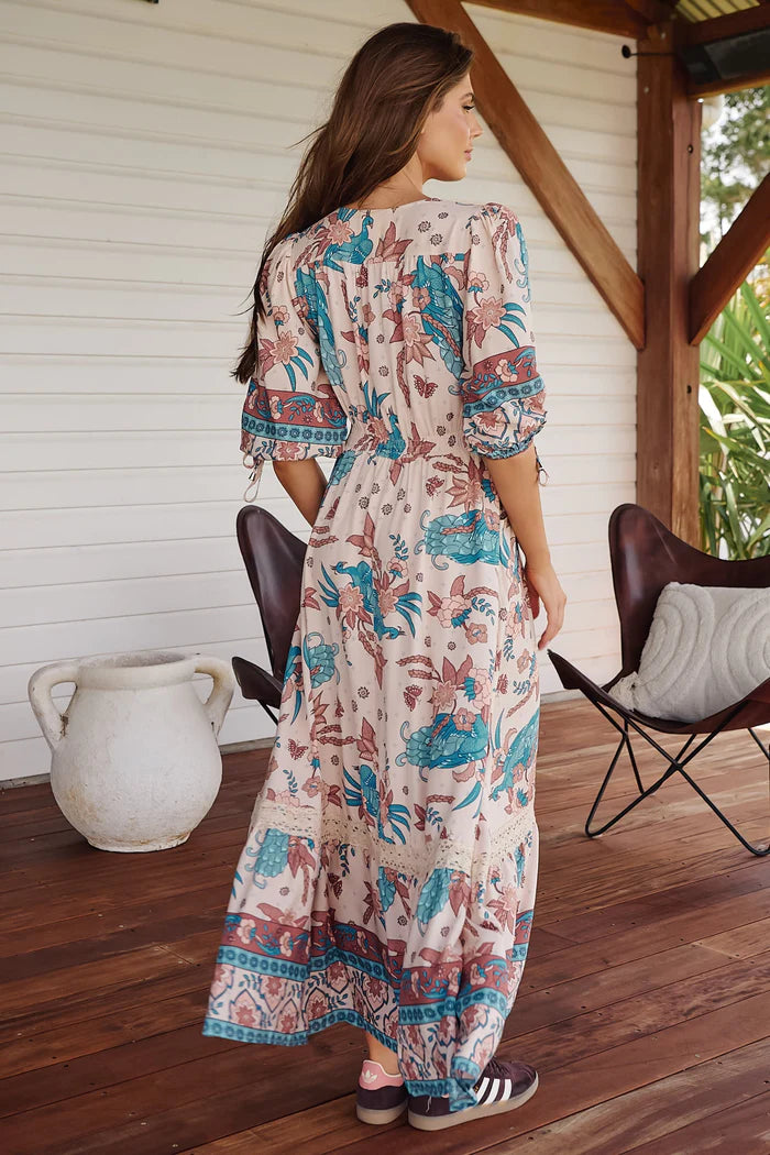 Get ready to rock out in style with our Molli Maxi dress. The symphony print adds a touch of whimsy while the button detail and pockets provide functionality. With an elasticised waist and 3/4 sleeves, this dress is both comfortable and chic. Who says fashion can't be practical?!