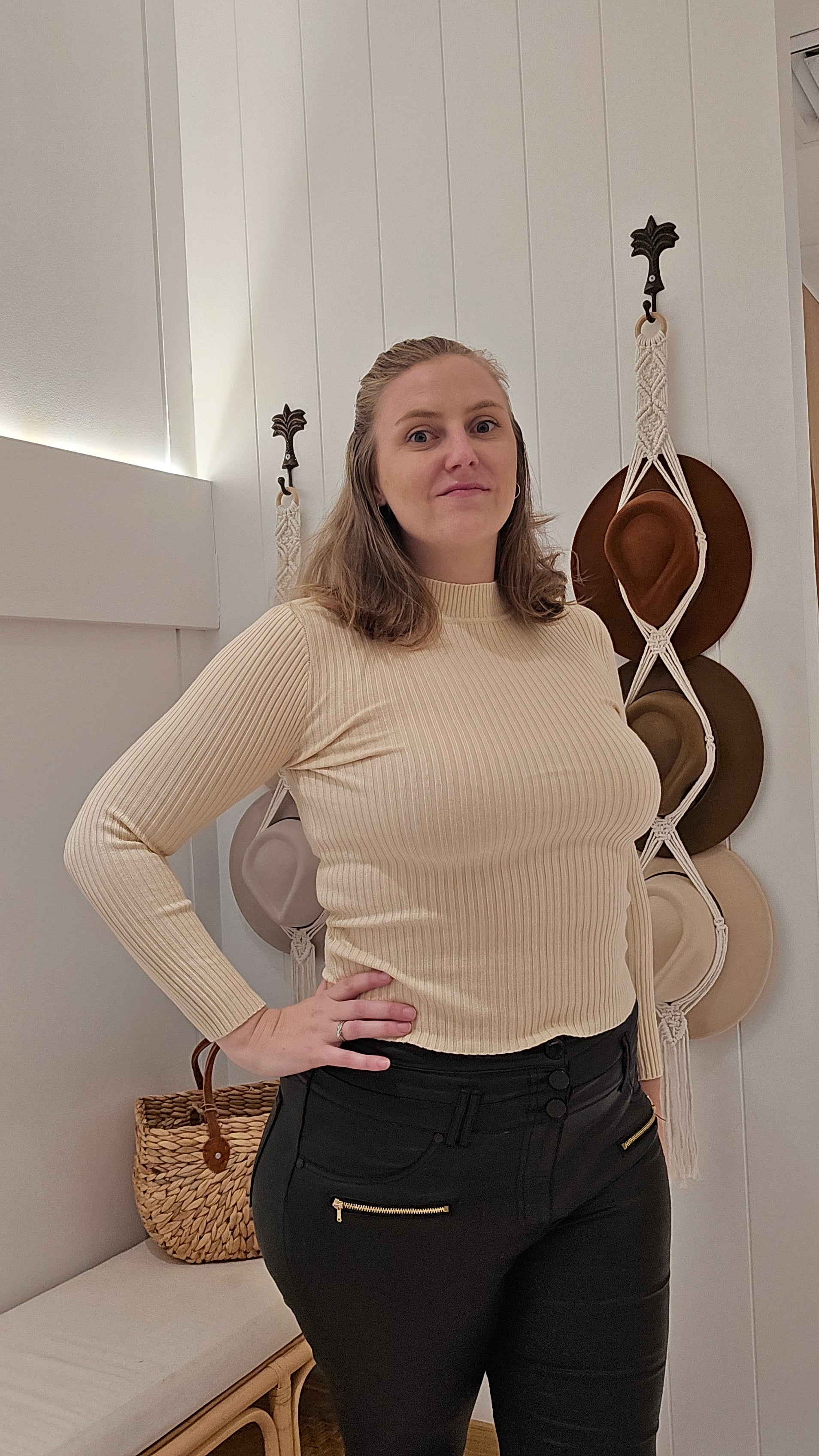 Introducing our Erin Ribbed Skivvy in Cream! Made with a stretchy knit fabric, this skivvy not only keeps you warm but also allows for flexibility. The long sleeves and high skivvy neck provide additional coverage during colder days. Upgrade your wardrobe with this versatile and comfortable piece!