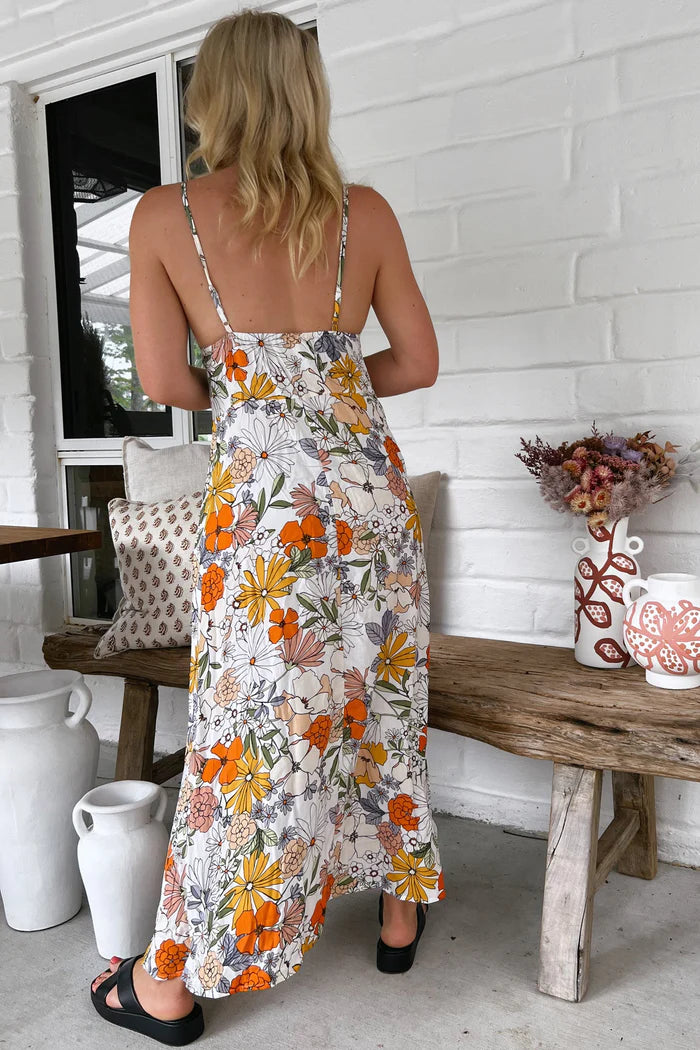 Get ready to turn heads with the Porter Slip Dress in the unique Dalilah print. With its ankle-length and adjustable straps, this slip dress offers both style and comfort. The V neckline adds a touch of elegance to this playful piece. Perfect for making a statement!