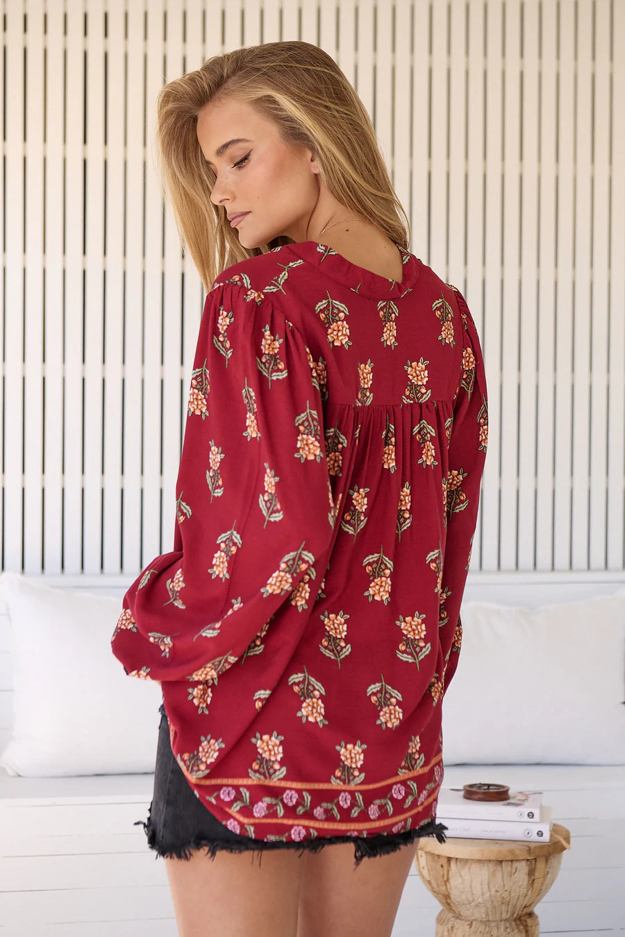 Take your style to the next level with our Bee Blouse - Grenache Print! Featuring a playful V neck line and a small collar, this blouse is perfect for any occasion. The long sleeves with relaxed cuffs and relaxed style add a touch of effortless chic. Buzz-worthy fashion at its best!