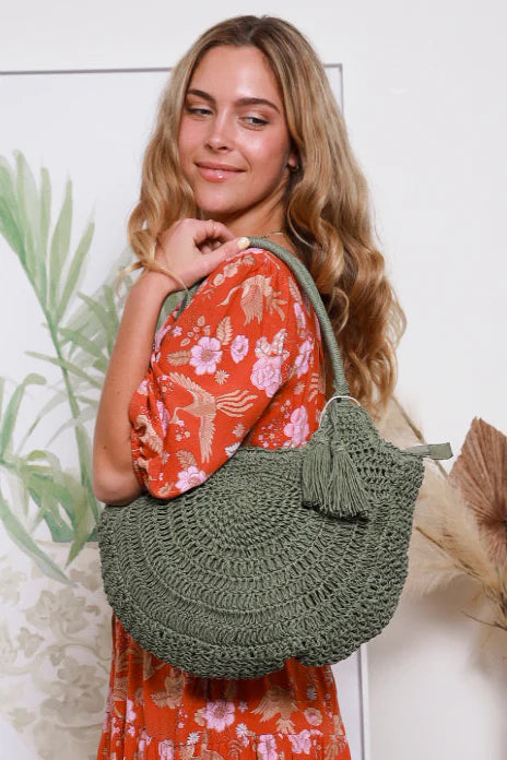 This Woven Summer Bag is the perfect accompaniment to summer fun. Handcrafted with intricate woven details and playful tassel features, it stands out in the chicest of fashion. Boasting an easy-to-wear over the shoulder handle, you'll be the most stylish one at the beach.