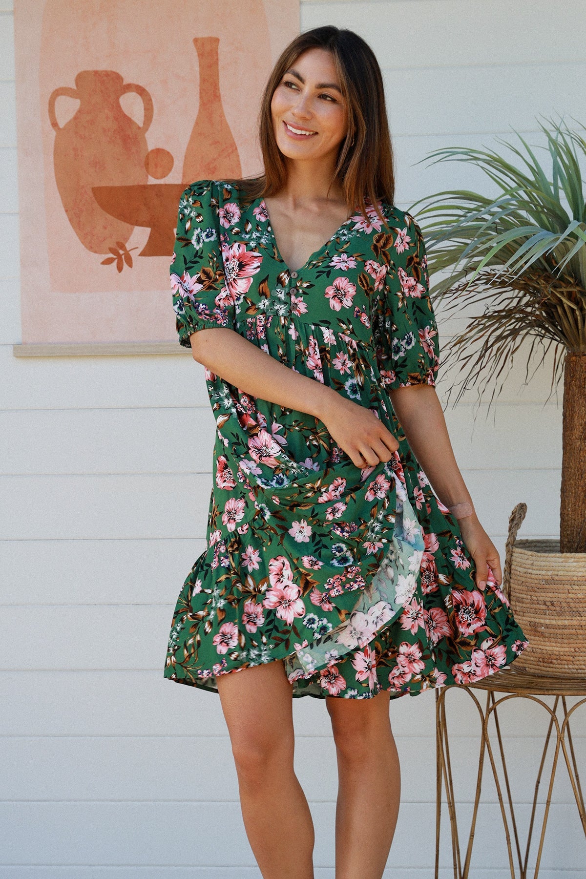 The Daisy Mini Dress is here to bring a bit of sunshine and a lot of chic style to your wardrobe! Featuring a V-neckline, elasticated sleeves, button detail, and a tiered style, this dress is ready to bring some flower power to your summer look!