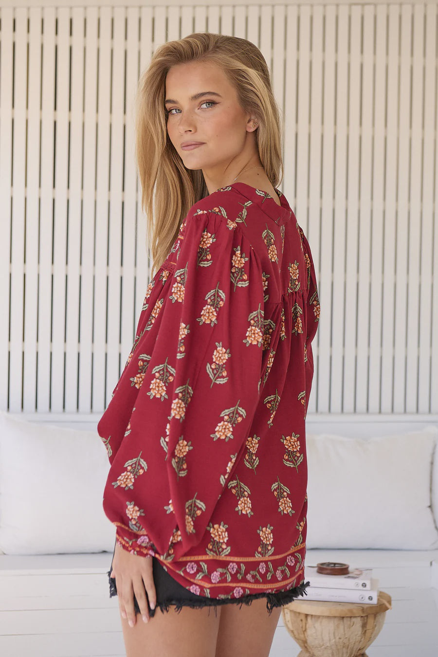 Take your style to the next level with our Bee Blouse - Grenache Print! Featuring a playful V neck line and a small collar, this blouse is perfect for any occasion. The long sleeves with relaxed cuffs and relaxed style add a touch of effortless chic. Buzz-worthy fashion at its best!