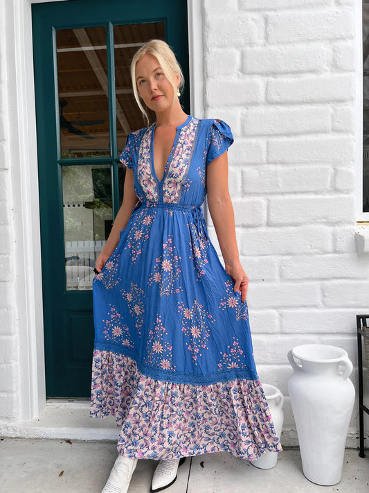 Step into the bohemian vibes of the Mika Maxi Dress! Featuring a flattering v-neckline, delicate crochet detailing, and a drawstring waist for a customizable fit. Complete with convenient pockets and flowy sleeves, this dress effortlessly combines style and functionality. Perfect for any occasion, add this bold Hailee print dress to your wardrobe today!