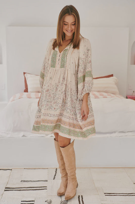 Indulge in the luxurious oversized fit of the Adela Mini dress in Mist Flower. With a button bodice and border print, this mini dress is perfect for making a statement at any event. Elevate your style with this elegant and exclusive piece.