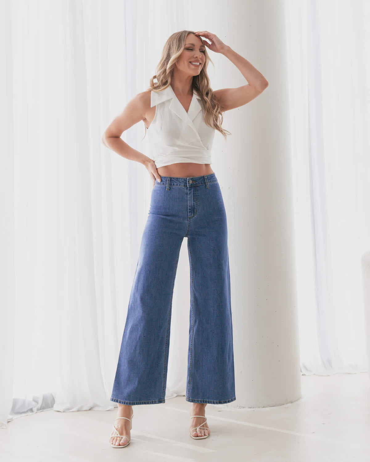 Introducing the Ebby Jeans - Blue! With back pockets for added convenience, a high waist for a flattering silhouette, and a wide leg design for comfortable wear. Made from breathable fabric, these jeans also come equipped with belt loops. Upgrade your denim game with Ebby!