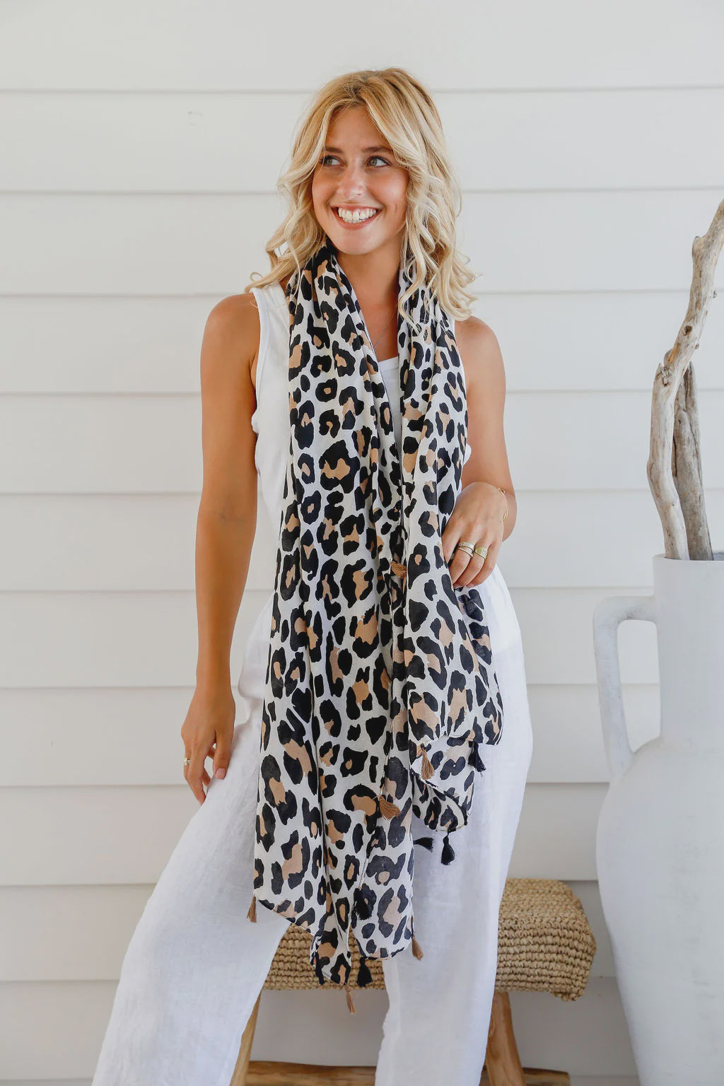 Take a walk on the wild side with our Animal Print Natural Light Scarf! Made with a lightweight material and accented with playful tassels, this scarf is perfect for adding a touch of adventure to any outfit. The perfect accessory for those who like to take risks and make a bold statement!