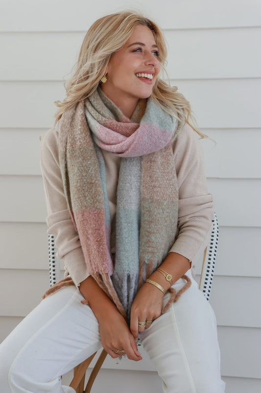 Stay cozy and stylish in our Winter Scarf - Mint Pink. Made for chilly days with its winter weight and soft touch, while adding a touch of fun with fringing. Wrap yourself up in warmth and comfort, perfect for any winter adventure.