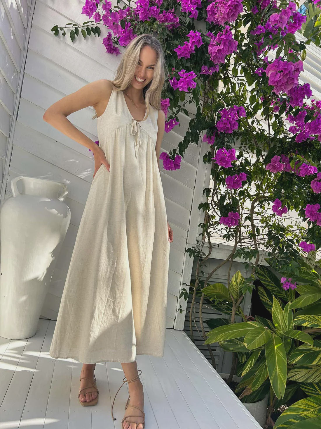 Indulge in the luxurious and exclusive Peyton Maxi - Natural. With its delicate tie bust and elegant lining, this maxi dress exudes sophistication. And with convenient pockets, you'll have both style and practicality at your fingertips. Elevate your wardrobe with this must-have piece.