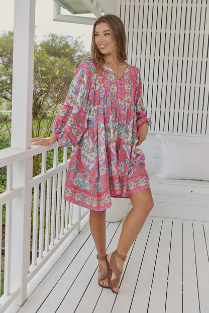 Indulge in pure elegance with our Adela Midi Dress in Daiquiri Print. This stunning piece features delicate lace detailing on the bust and sleeves, while the V-neckline and contrast yoke add a touch of sophistication. With balloon sleeves, front pockets, and an oversized style, this dress exudes luxury. Complete with a beautiful border print and mid-thigh length, it's the perfect addition to your wardrobe.