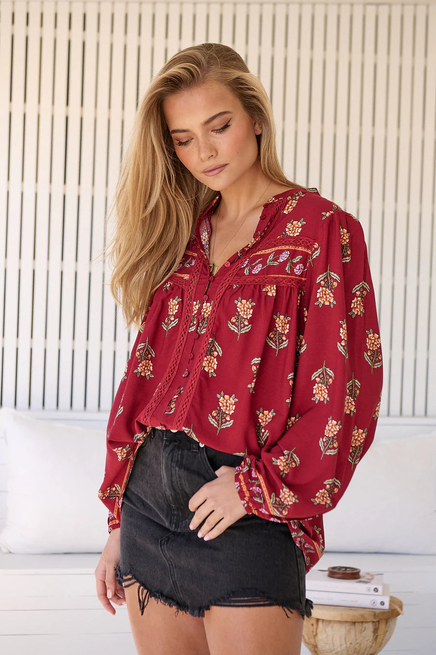 Take your style to the next level with our Bee Blouse - Grenache Print! Featuring a playful V neck line and a small collar, this blouse is perfect for any occasion. The long sleeves with relaxed cuffs and relaxed style add a touch of effortless chic. Buzz-worthy fashion at its best!