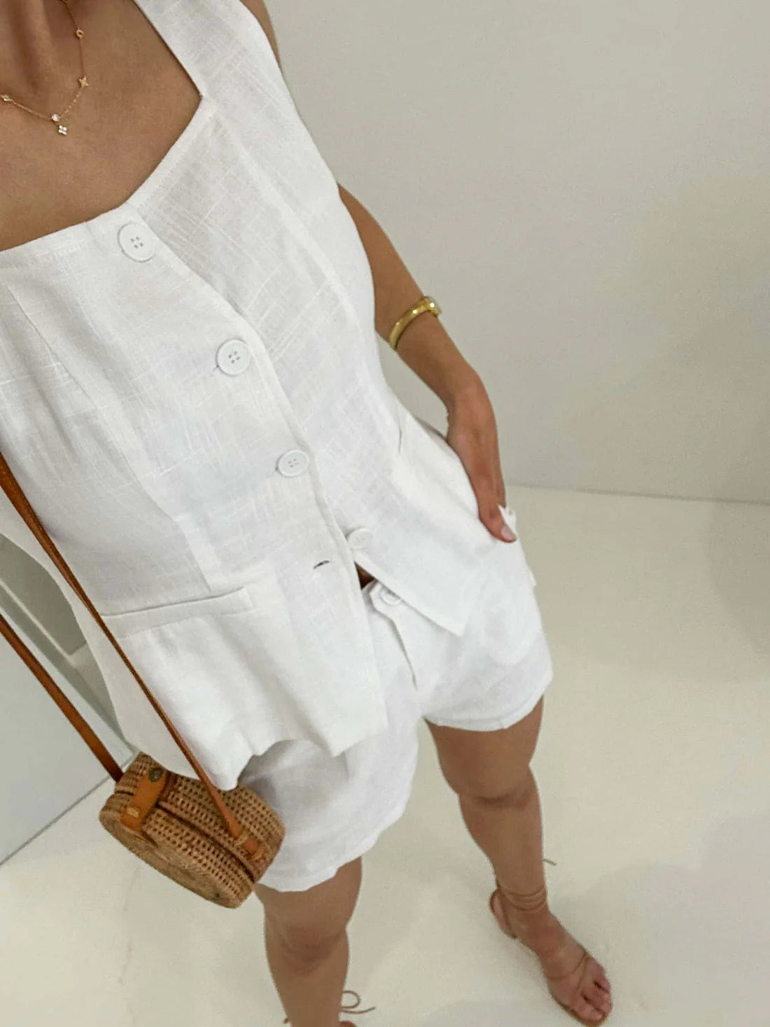 Elevate your summer wardrobe with these Amie Shorts in white. Crafted from luxurious, lined fabric, these shorts feature functional buttons and pockets for added convenience and style. Perfect for a day out in the sun or a night on the town.