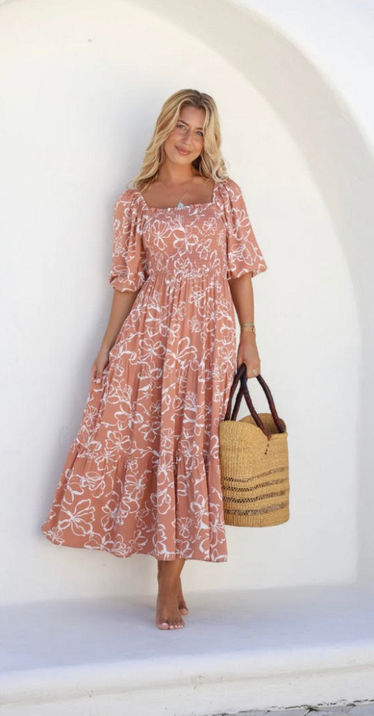 Get ready to turn heads with the Havana Ruched Maxi dress! Made from lightweight and breathable 100% Rayon, this versatile dress can be worn off or on the shoulder. The ruched bodice and elasticised waist provide a flattering fit, while the 3/4 sleeves and 3-tier skirt add a touch of elegance. Perfect for any occasion!