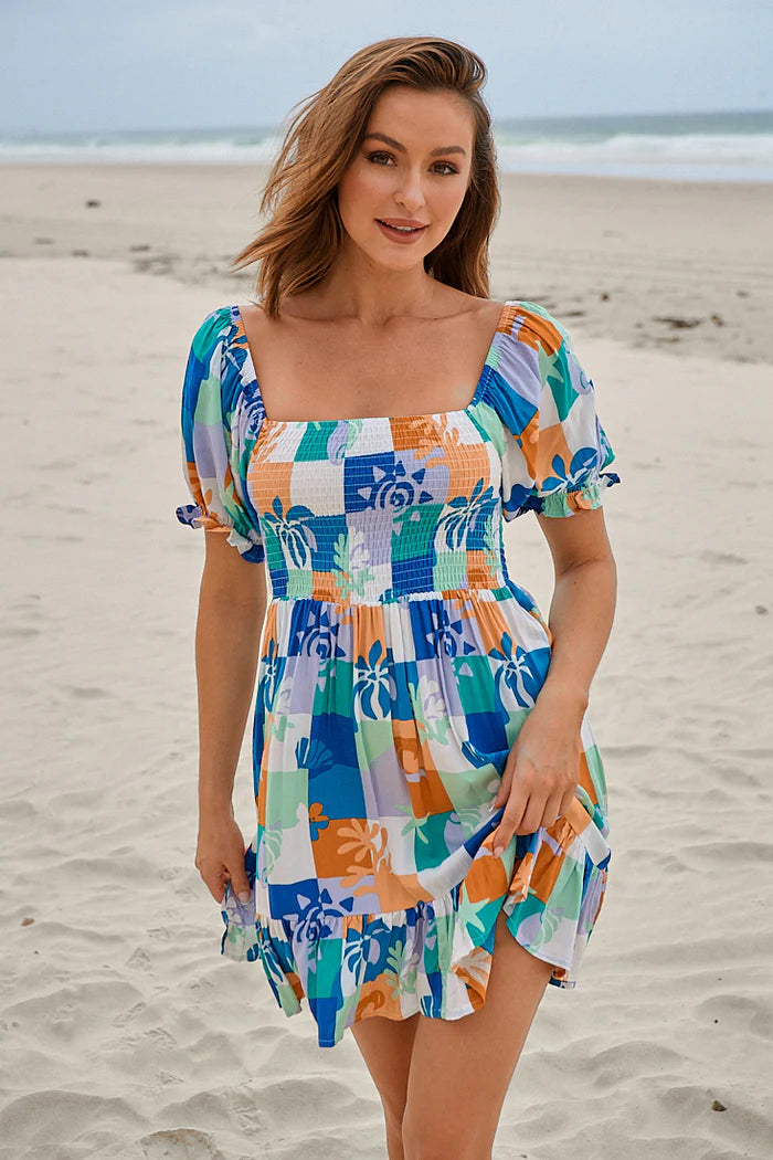 Playful and versatile, the Louise Mini Dress features elasticised cuffed sleeves and a shirred bodice for comfort and style. With a square neckline and the option to wear on or off the shoulder, this dress offers endless possibilities for expressive, effortless fashion.