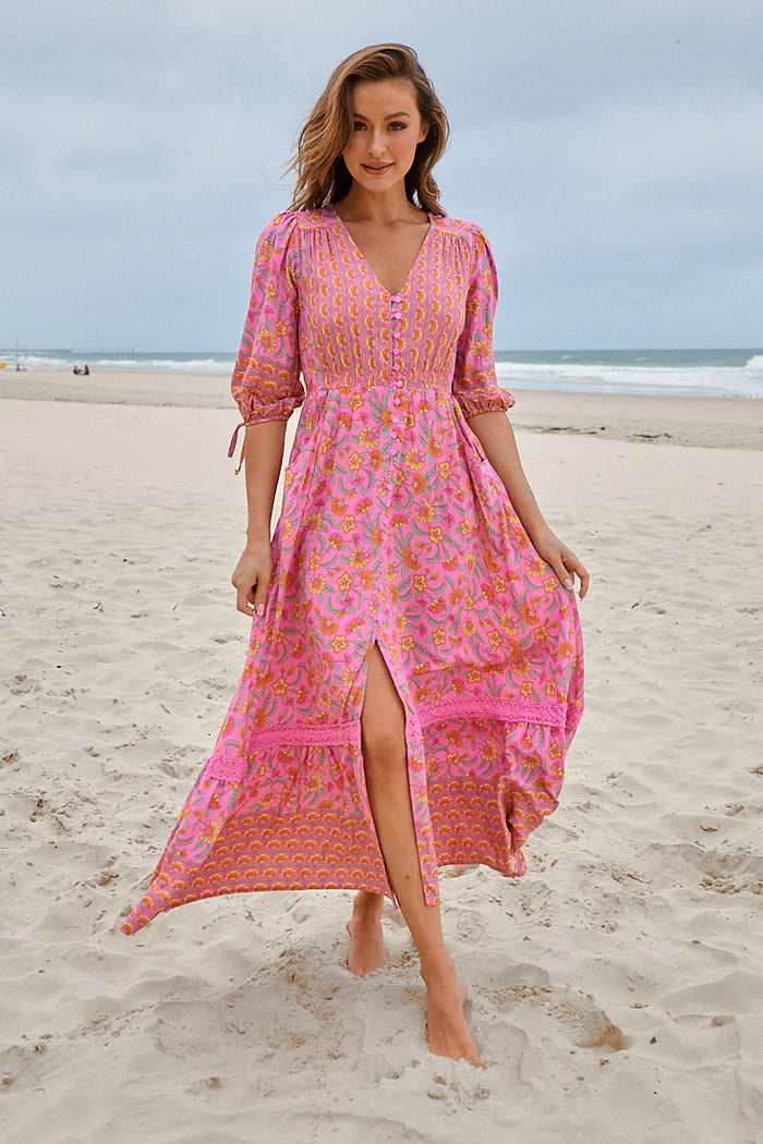 The Molli Maxi Dress features a delicate rosewater print, button detail, and 3/4 sleeves. With an elasticised waist and pockets, it offers both style and convenience. Perfect for any occasion with its elegant and comfortable design.