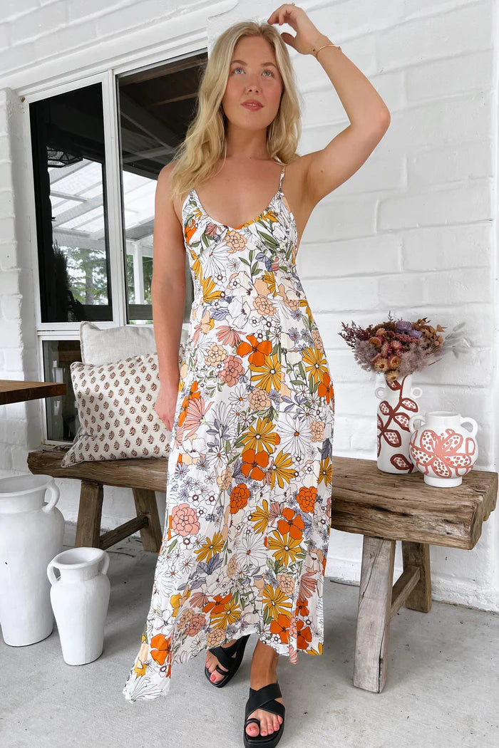 Get ready to turn heads with the Porter Slip Dress in the unique Dalilah print. With its ankle-length and adjustable straps, this slip dress offers both style and comfort. The V neckline adds a touch of elegance to this playful piece. Perfect for making a statement!