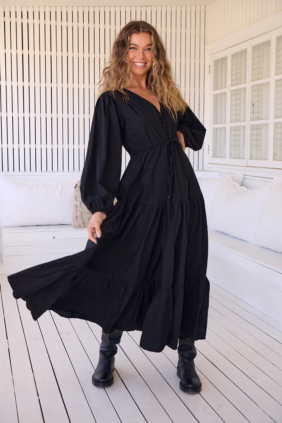 Unleash your inner goddess in the Teresa Maxi dress! With a sleek v-neckline and billowy sleeves, this dress is both elegant and comfortable. The button down bust adds a touch of whimsy, while the tie-up waist cinches your waist for a flattering silhouette. Available in versatile Onyx, this dress is perfect for any occasion.(Goddess-worthy!)