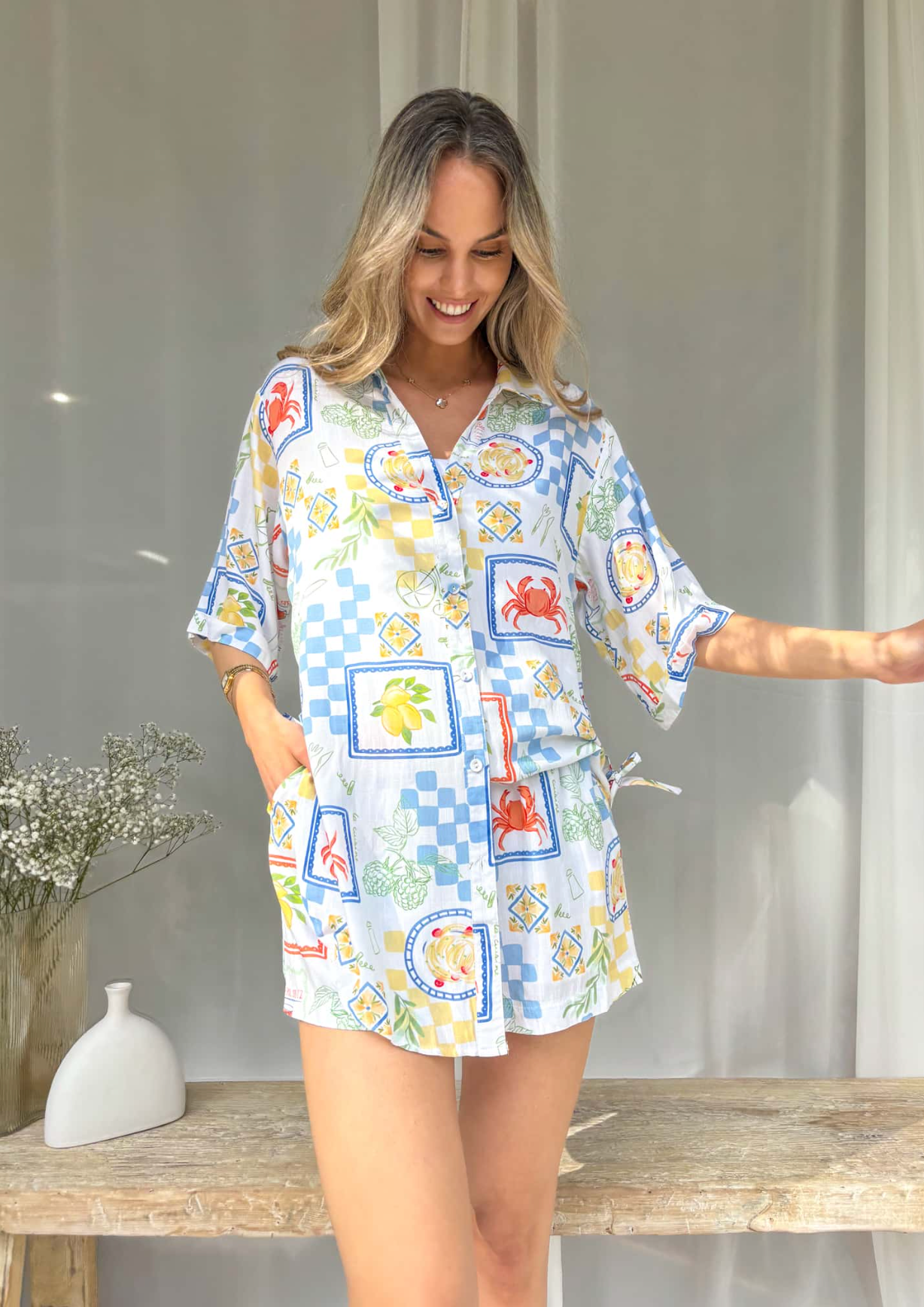 Introduce some luxury into your wardrobe with the Aria Set - Picnic Print. Featuring an oversized top with functional buttons, the lined short also boast an elasticated and drawstring waist, complete with a contrast rope drawstring. Perfect for adding some sophistication to your look.