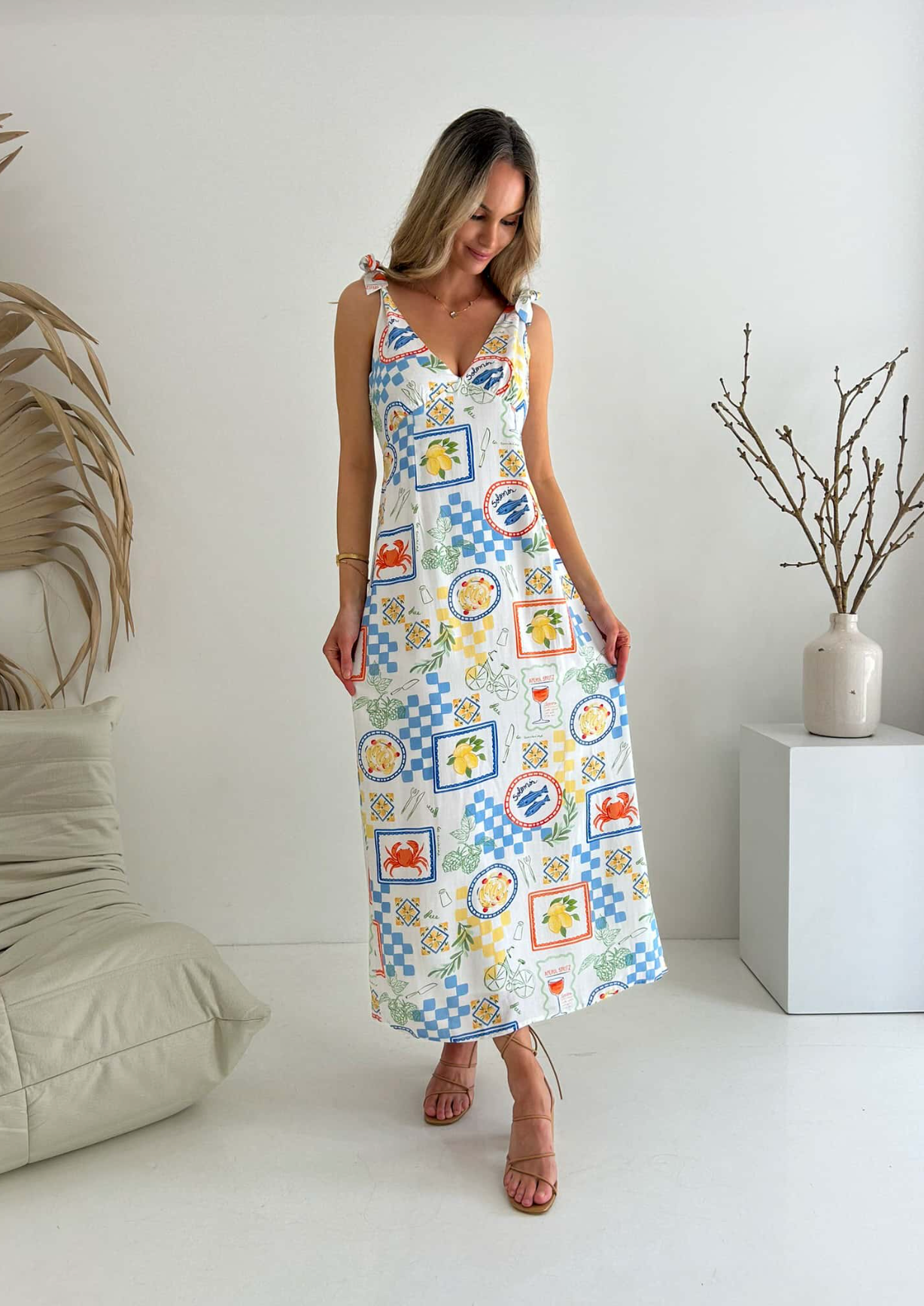 Get ready for a picnic in style with the Matilda Tie Maxi! Made of lightweight cotton fabric and fully lined for comfort, this dress features adjustable tie shoulder straps for the perfect fit. Be the talk of the picnic with our exclusive Picnic Print design. And with a ruched back and zip closure, you'll be both stylish and comfortable. Time to pack the basket!