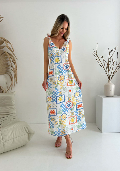 Get ready for a picnic in style with the Matilda Tie Maxi! Made of lightweight cotton fabric and fully lined for comfort, this dress features adjustable tie shoulder straps for the perfect fit. Be the talk of the picnic with our exclusive Picnic Print design. And with a ruched back and zip closure, you'll be both stylish and comfortable. Time to pack the basket!