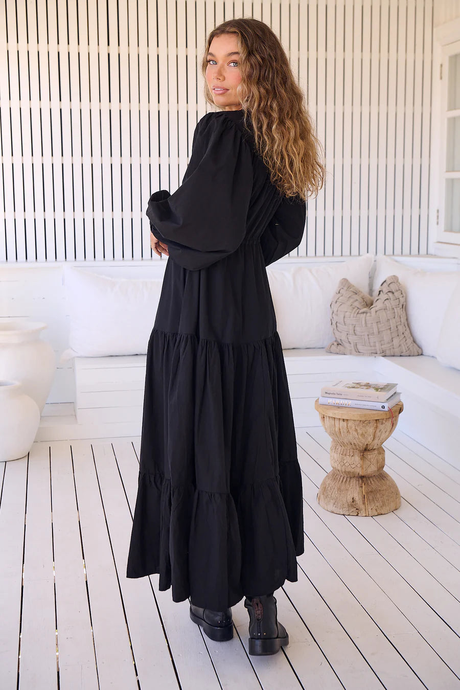 Unleash your inner goddess in the Teresa Maxi dress! With a sleek v-neckline and billowy sleeves, this dress is both elegant and comfortable. The button down bust adds a touch of whimsy, while the tie-up waist cinches your waist for a flattering silhouette. Available in versatile Onyx, this dress is perfect for any occasion.(Goddess-worthy!)