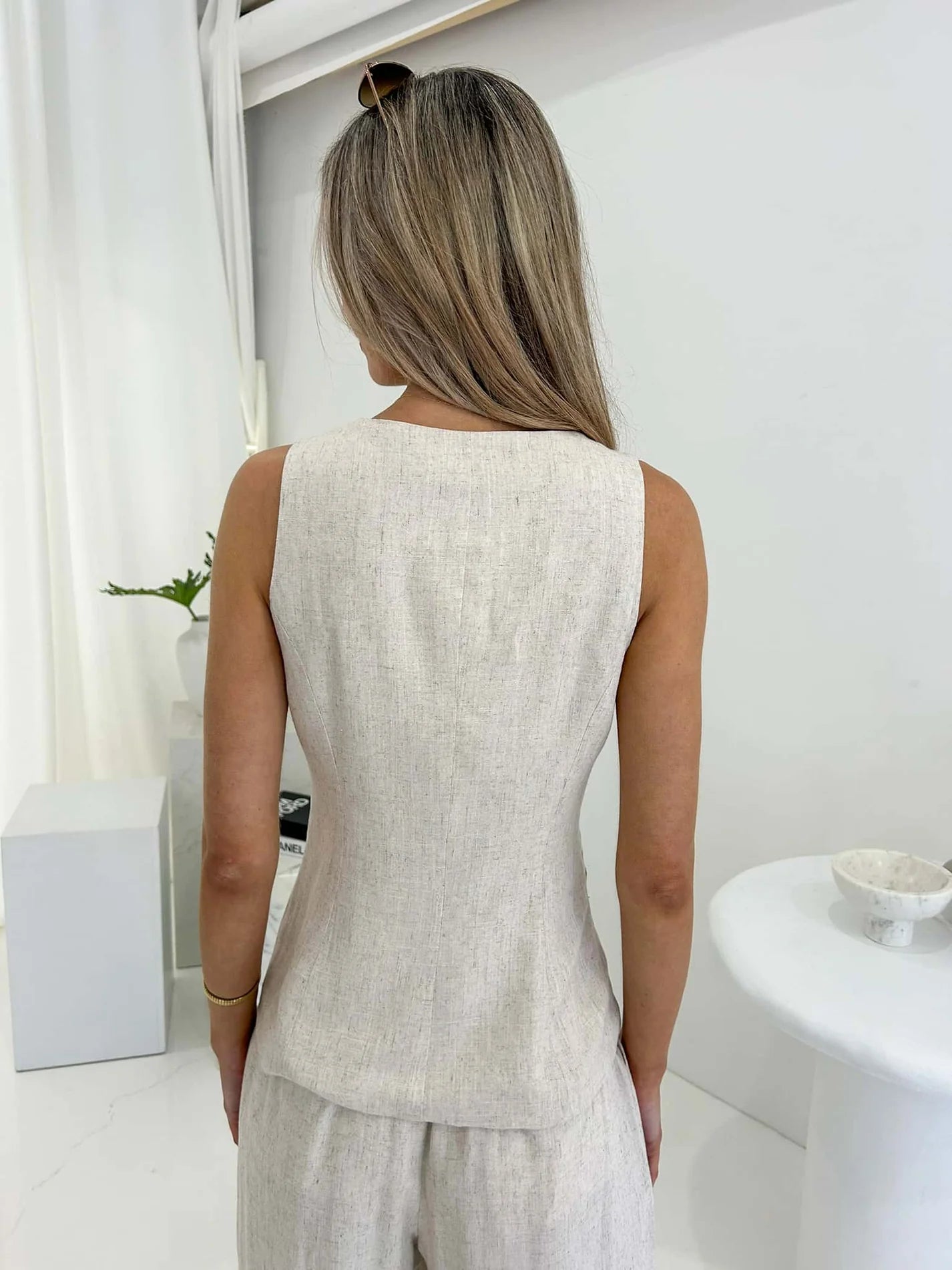 Indulge in luxury with our Ollie Tie Vest. This chic and sophisticated vest features intricate tie up front details, adding a touch of elegance to any outfit. Made from a premium blend of cotton and linen, it is both stylish and comfortable. The vest also includes pockets and a lining for added practicality. Elevate your wardrobe with this exclusive piece.