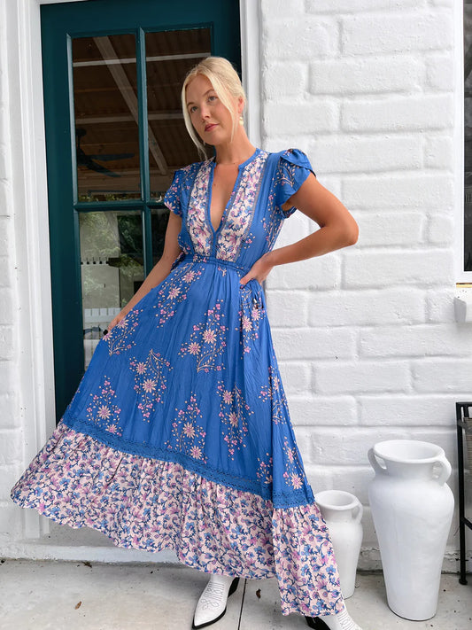 Step into the bohemian vibes of the Mika Maxi Dress! Featuring a flattering v-neckline, delicate crochet detailing, and a drawstring waist for a customizable fit. Complete with convenient pockets and flowy sleeves, this dress effortlessly combines style and functionality. Perfect for any occasion, add this bold Hailee print dress to your wardrobe today!