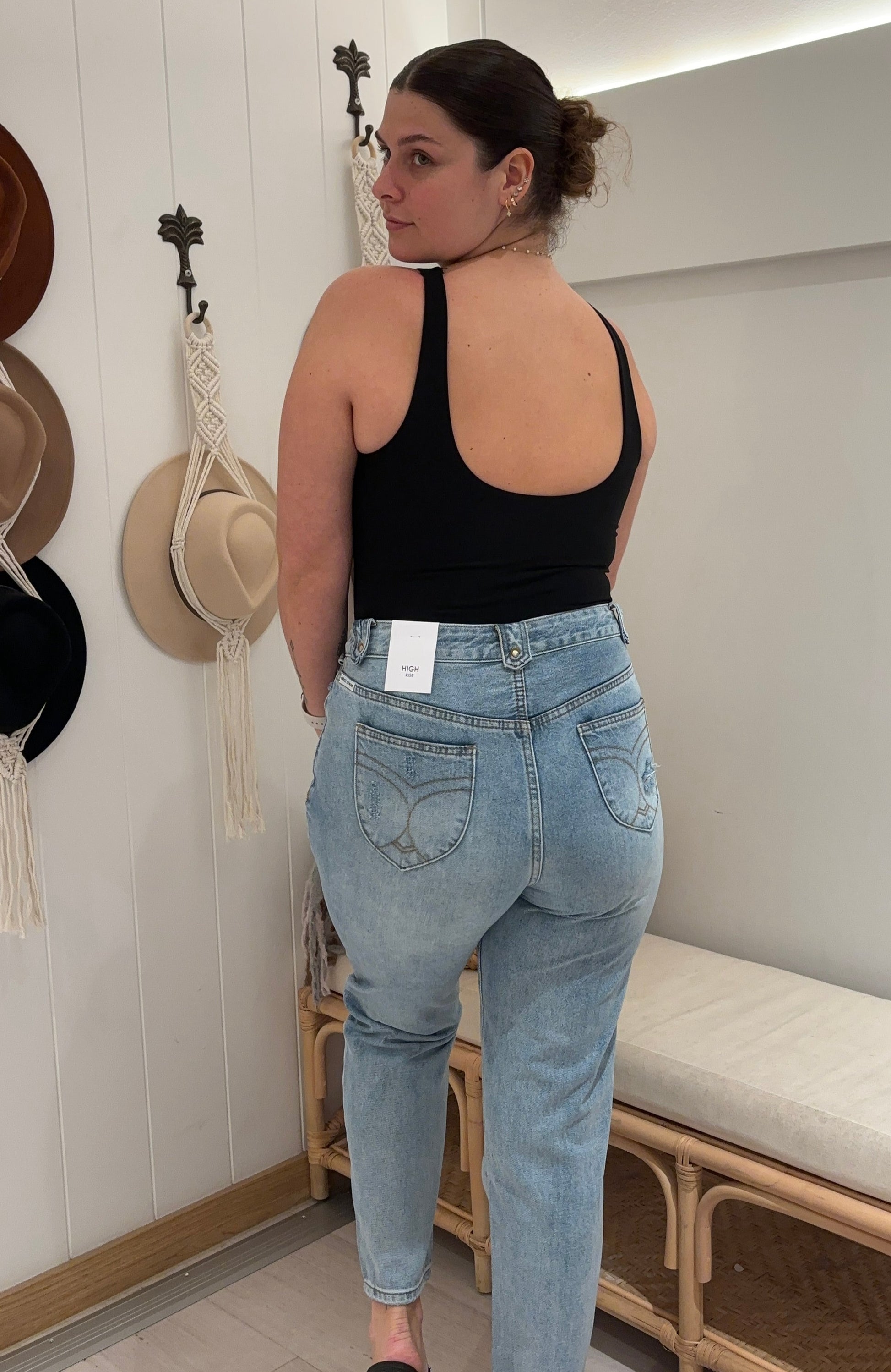 Elevate your denim game with Refuge Denim's Ocean Wash Jeans. These high-waisted, non-stretch jeans feature wide cowgirl belt loops and stylish rips at the hip. Perfect for adding a touch of edge to your wardrobe. (Yee-haw!)