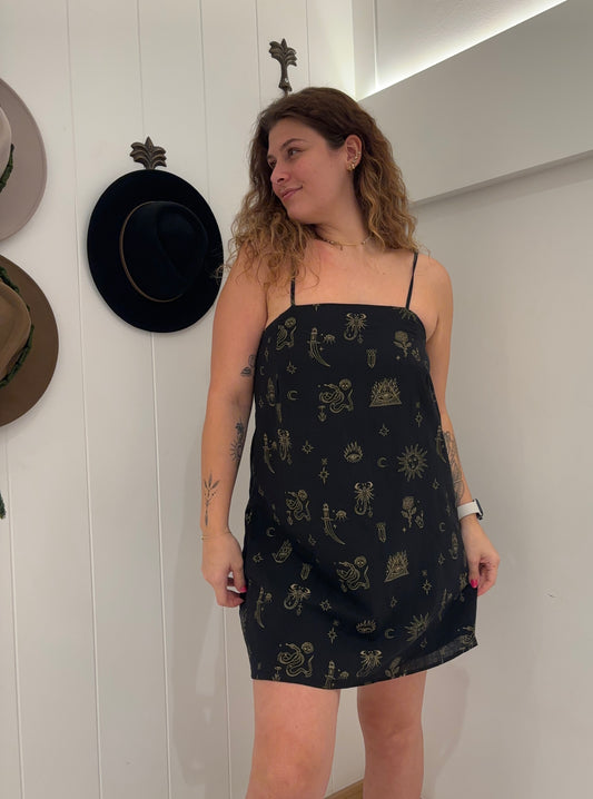 Slip into something sassy and comfortable with our Black/Tan Scorpion Mini Dress. Featuring adjustable string straps, an elastic back, and soft, breathable fabric, this dress offers both style and comfort for any occasion. (Warning: may cause some serious head-turning!)