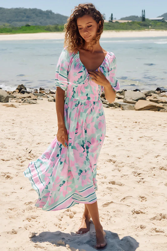 This Cascade Maxi Dress in Voyage Print is anything but ordinary. With a V-neckline, elasticated cuff sleeves, shirred waist and tie up detail, you'll be the envy of any gathering! Get ready for a stylish voyage!
