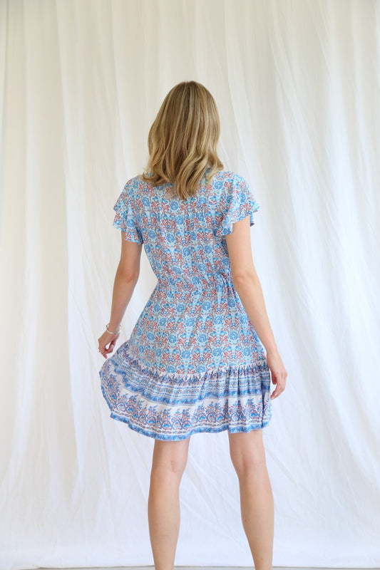 Get ready to turn heads in the Zora Mini Dress! With a drawstring waist for a flattering fit, a tiered style for a touch of whimsy, a v neckline for a hint of allure, and sleeves for a bit of coverage, this dress is perfect for any occasion. Look fabulous and feel confident in this must-have dress!