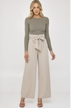 Effortlessly elevate your style with our Louisa Pants in elegant beige. The paper bag style and wide leg design exude sophistication, while the pockets and tie up waist add a touch of functionality. Embrace luxury and comfort with every wear.