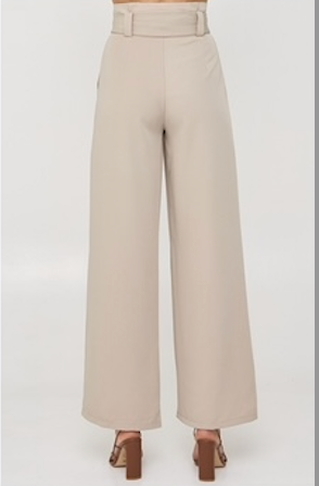 Effortlessly elevate your style with our Louisa Pants in elegant beige. The paper bag style and wide leg design exude sophistication, while the pockets and tie up waist add a touch of functionality. Embrace luxury and comfort with every wear.